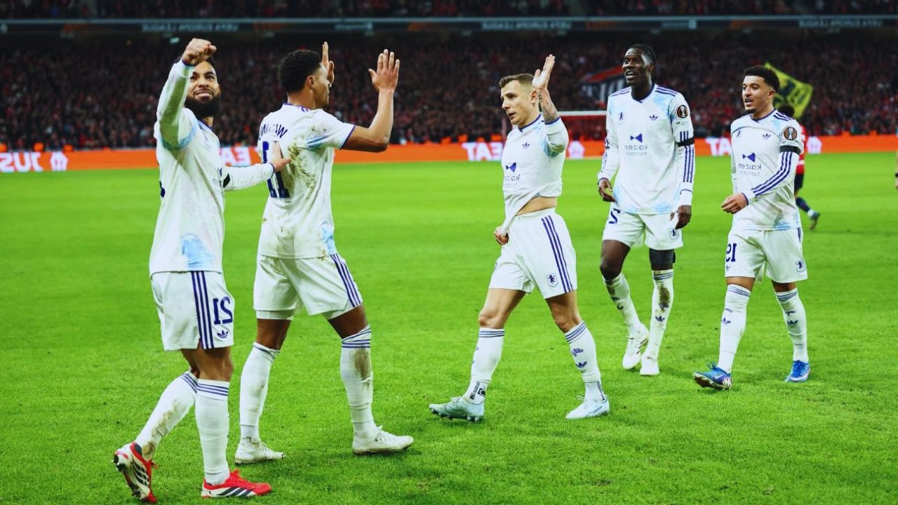 Aston Villa players celebrate after scoring a goal against Lille in the Europa League round of 16